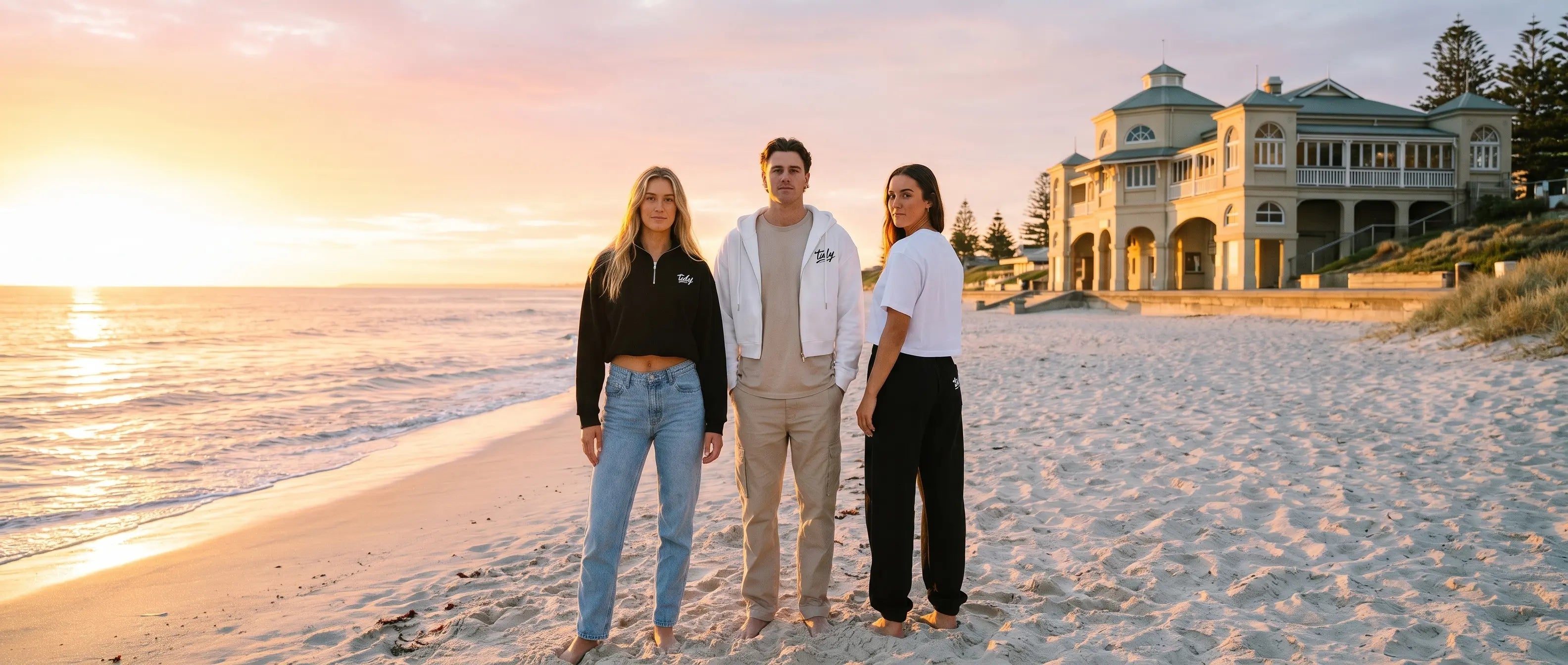 Tidy Originals collection — three models at Cottesloe Beach Perth at golden hour wearing Tidy Originals pieces