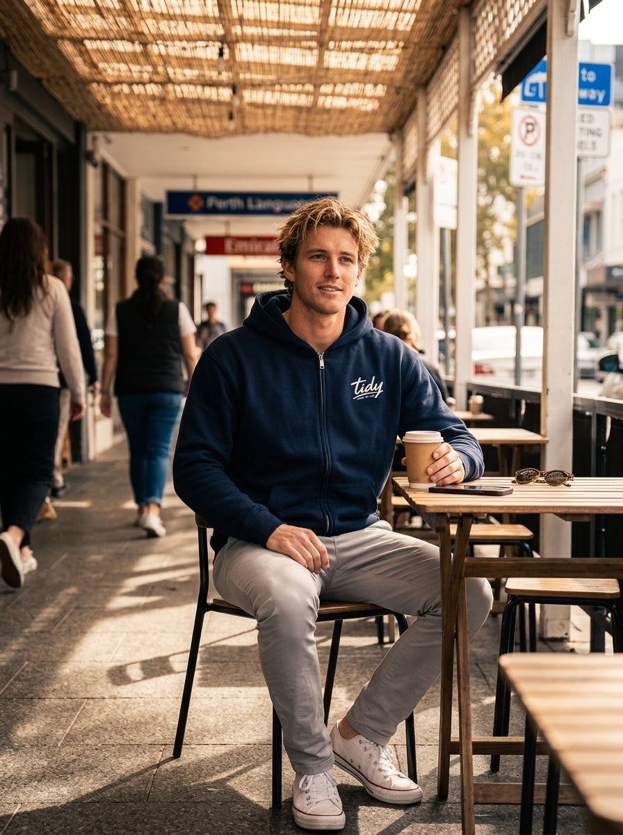 Tidy Originals Heavyweight Zip-Up Hoodie White Logo — man at Perth sidewalk café